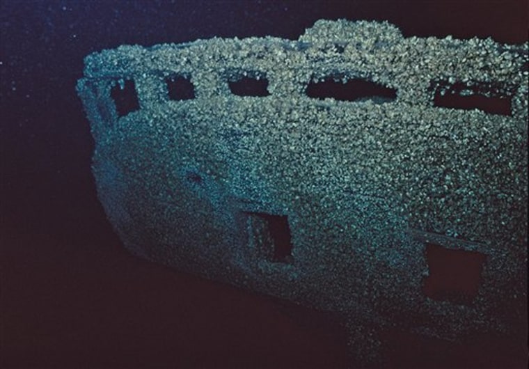 In this 2010 photo taken from video and provided by Michigan Shipwreck Research Associates, the stern of an unnamed 60-foot, single-masted sloop, covered in zebra mussels, that may date back to the 1830s, is shown in Lake Michigan. The wreck was found off southwestern Michigan in water about 250 feet deep between Saugatuck and South Haven, Mich. 